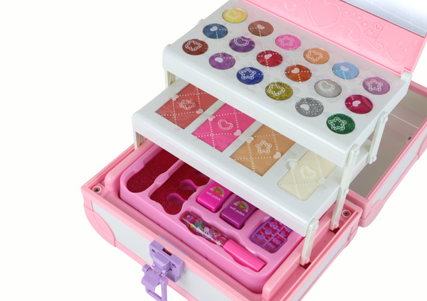 Set of beauty cosmetics for make-up doing nails in a pink case