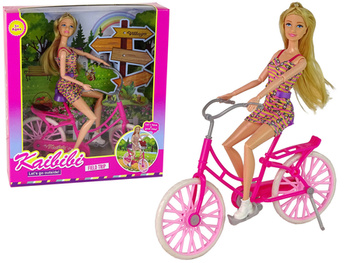 Puppe auf einem Fahrrad, Rosa
