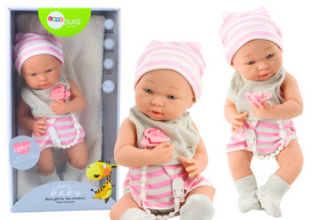 Babypuppe in weißer und rosa Kleidung, Mütze, Schnuller, Lätzchen, Steppdecke