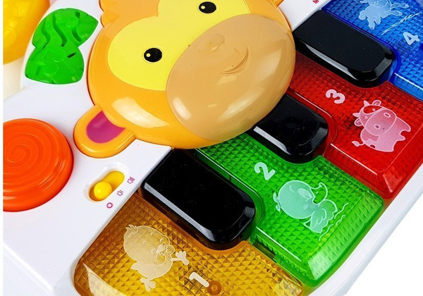 A piano with a monkey for a baby. Sound and light