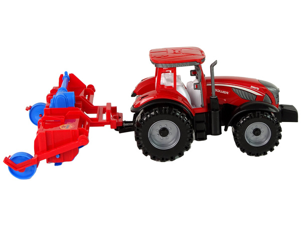 Roter Traktor mit Pflug Friktionsantrieb