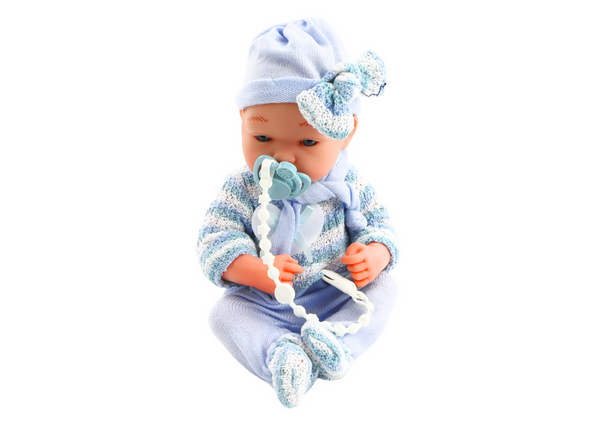 Babypuppe, gestreifter Pullover, Mütze, blauer Schal