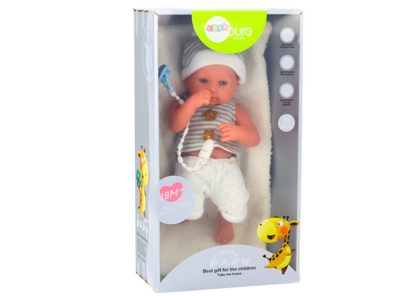 Baby doll in white and gray clothes, hat, pacifier, and blanket