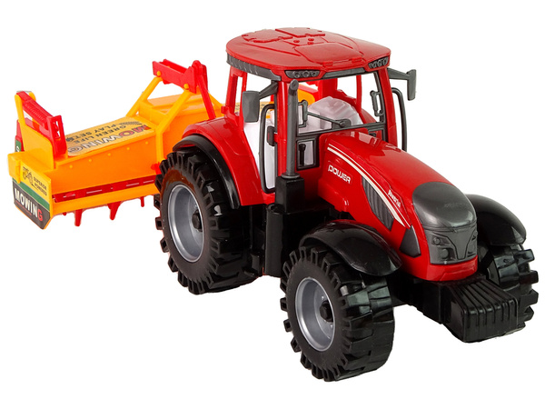Roter Traktor mit orangefarbenem Grubberantrieb