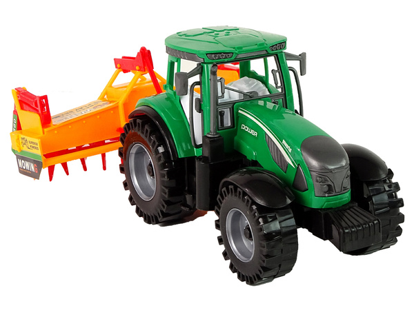 Grüner Traktor mit orangefarbenem Grubber für Kinder